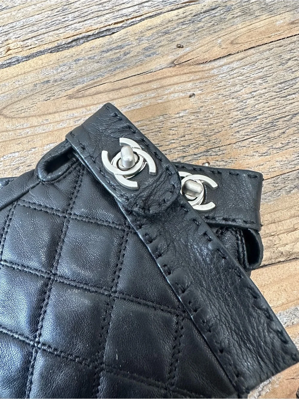 CHANEL Black Quilted Fingerless Leather Gloves with CC Snap